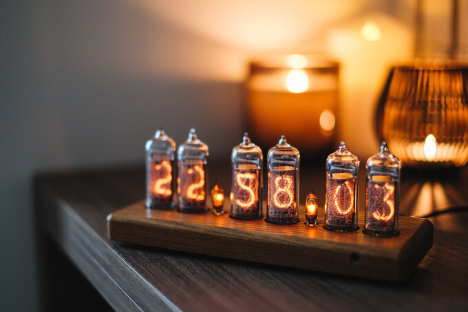 Nixie clock in wooden enclosure.