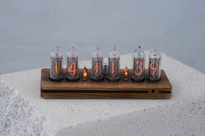 Nixie clock in wooden enclosure.