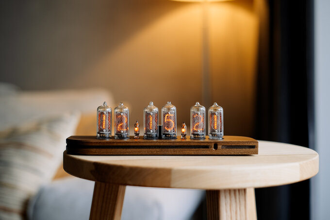 Nixie clock in wooden enclosure.