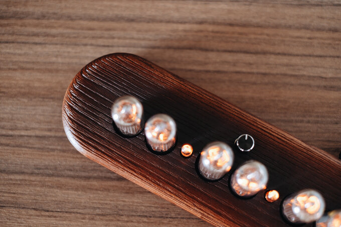 Nixie clock in wooden enclosure.