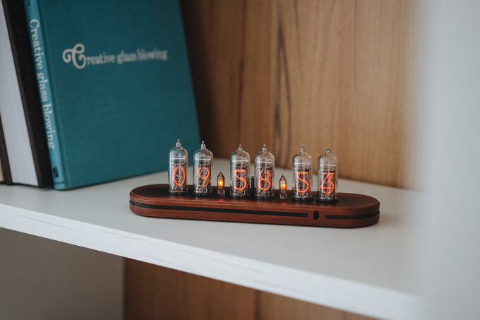 Nixie clock in wooden enclosure.