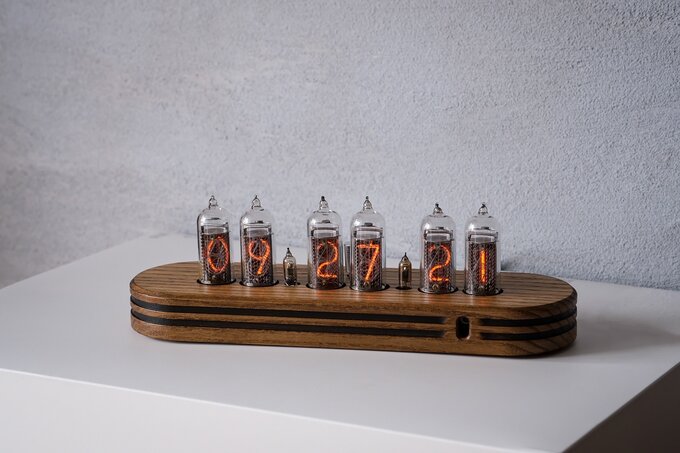 Nixie clock in wooden enclosure.